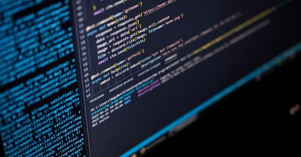 Close-up of a computer screen displaying HTML, CSS, and JavaScript code