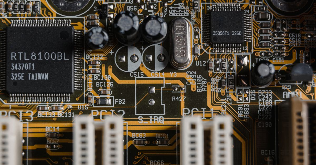 Detailed view of a motherboard with visible microchips and circuits.